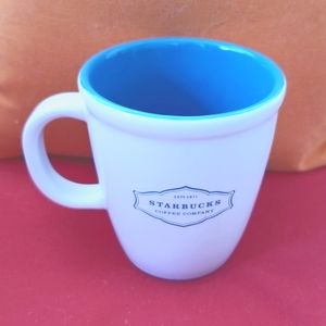 Starbucks mug for coffee or tea. White with teal blue accents and inside